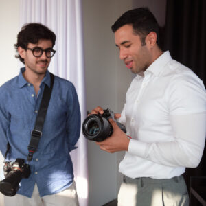 Lux Photo Club members discussing a camera