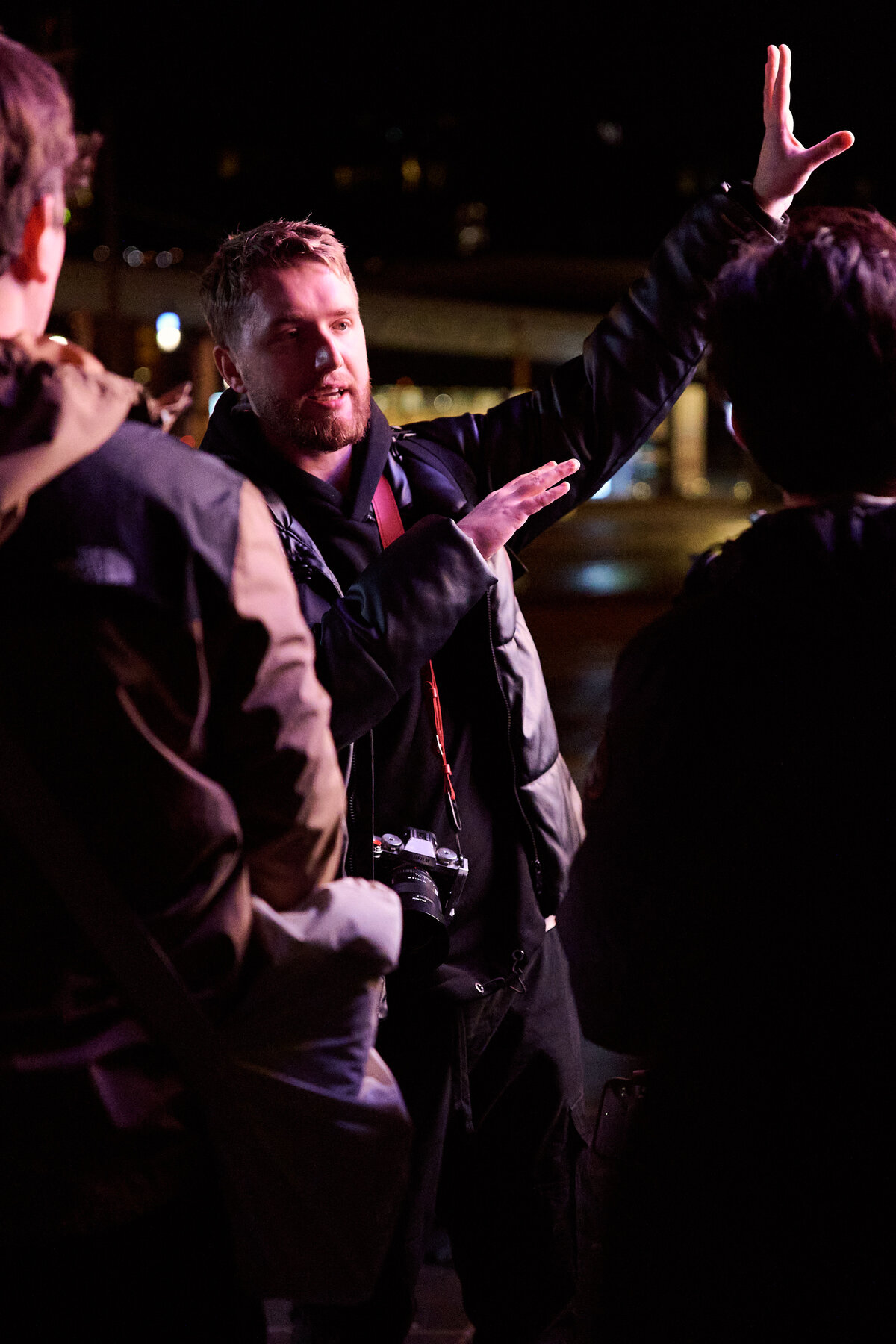 Group photographing at night on a Lux Photo Club photo walk