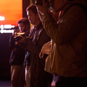 Photographer shooting at night on a Lux Photo Club photo walk